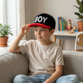 Front view of boys winter printed cap with letter design