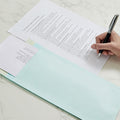 Multiple Polynet premium card envelopes stacked together