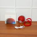 Interactive cat toy ball showing USB charging port and included cable