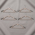 Sturdy plastic clothes hangers for daily wardrobe use