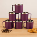 Single coffee mug from set highlighting ergonomic handle and steel interior