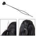 Hair clip set featuring stylish black heart-shaped pins
