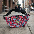 Travel-friendly waist bag featuring multiple secure zipper compartments