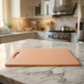 Fruit cutting on plastic chopping board with built-in handle