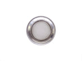 Stainless steel drain strainer placed inside a kitchen sink, ready for use.