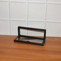 Back view of transparent floating jewelry display box showcasing sleek black ABS plastic frame