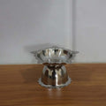 Silver-toned stainless steel sunflower diya for pooja and aarti rituals