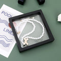 Elegant jewellery display frame with assorted jewellery pieces