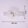 Close-up of colorful floral baby headband made from elastic fabric