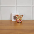 Festival gift Ganesha murti with golden decorative appearance