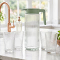 Glass jug pouring water view