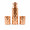Detailed view of the sleek design and polished finish of the copper drinking glasses.