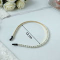 Decorative pearl studded gold hair band for festive occasions