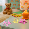 Three star-shaped snap hair clips neatly arranged on a clean white background.