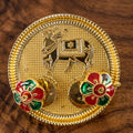 Ornate cow shaped kumkum holder for festivals and worship