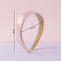 Detail shot emphasizing smooth satin finish of the padded hairband