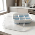 Durable plastic ice cube tray with a secure lid for spill free freezing.