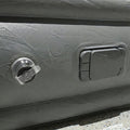 Portable inflatable bed partially folded illustrating compact and lightweight design