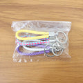Detailed image of the secure metal ring on a braided loop keychain