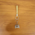 Lifestyle scene showing jeep-shaped metal car keychain in use with keys