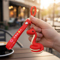 Close-up detailed view of the cartoon snake keychain figure with smooth finish