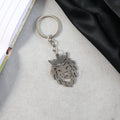 Crowned lion head keychain held in hand showing size and elegant design