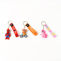 Detailed view of the metal hook and silicone strap on a cartoon silicone keychain.