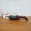 An Indian user demonstrates the manual knife sharpener on a steel blade.