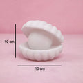 Front view of the glowing Pearl Shell Night Lamp, perfect for bedroom mood lighting.