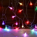 LED decorative string lights illuminating room with festive bubble ball bulbs