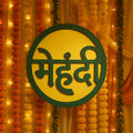 Indoors mehndi ceremony round decorative sign with typical Hindi ?????? lettering