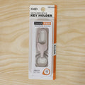 Metal keychain displayed with size reference