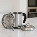 Durable oil filter pot with removable fine mesh strainer and ergonomic handle