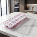 Side view of pink ice cube tray with lid
