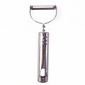 Stainless steel peeler on kitchen counter with peeled vegetables