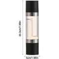 Manual dual-chamber salt and pepper grinder being used in kitchen