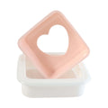 Close-up of heart bread mold design on sandwich cutter