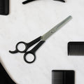 Hair thinning scissors showing detailed micro-toothed blade for bulk reduction