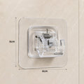 Size reference of transparent self-adhesive wall hook on white background