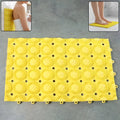 Close-up of suction cups beneath anti-slip bathroom massage mat