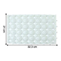 Close-up of textured surface on massage bath mat for foot stimulation