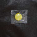 Reusable silicone bottle cap cover in use