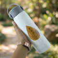 Side view of portable water bottle with phone holder