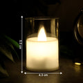 Flickering LED tealight candle glowing warmly in glass holder