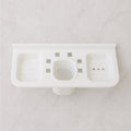 Side profile of the plastic soap dish holding a bar of soap, demonstrating its practical use.