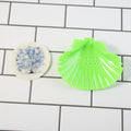 Wide spacious shell-shaped soap tray mounted on bathroom wall
