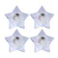 Flameless LED candles shaped like stars providing ambient light