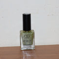 Starlet glitter nail paint shimmering on nails in Sunshine Gold shade