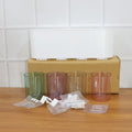 Plastic wall toothbrush rack with four inverted cups and grooming accessory slots
