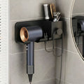 Dryer rack mounted on bathroom wall holding hair styling tools